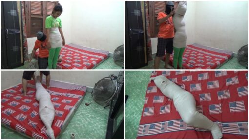 [RM033] a cute girl mummified with hands up pose