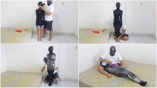 [RM056] A girl is mummified in black vet tape and covered with cling wrap