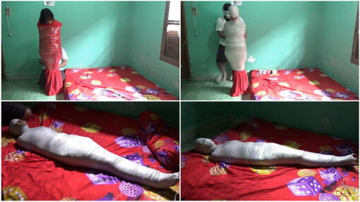 [RM063] A girl is wrapped in a red blanket and reinforced with duct tape