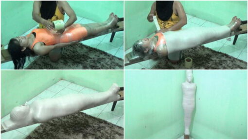 [RM099] A girl in an orange swimsuit is mummified on wood and breathplay