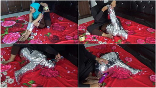 [RM132] A girl is wrapped tightly in a difficult Sitting position with chrome duct tape