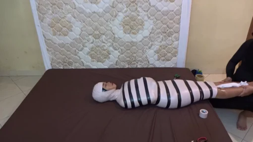 [RM143] A Girl Wrapped Into A Mummy Only Breathes From A Small Pipe And Given Vibrator Stimulation - Image 4