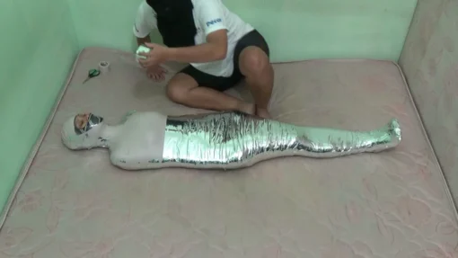 [RM112] Beautiful Girl In Swimsuit Wrapped Tightly Into A Mummy In 2 Layers Of Duct Tape - Image 4