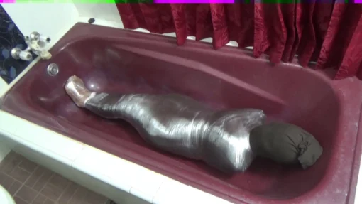 [RM114] A girl is wrapped in 3 layers of leggings plus layers of plastic until tight - Image 4