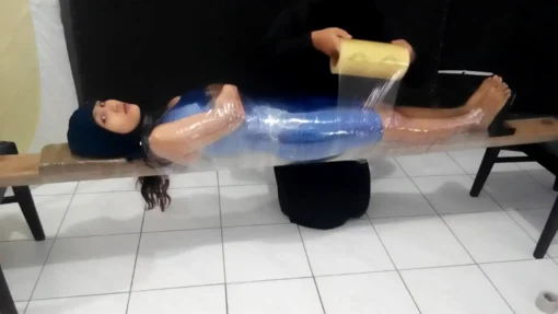 [RM129] Beautiful girl wrapped into wood tightly and face covered in swimcap - Image 2