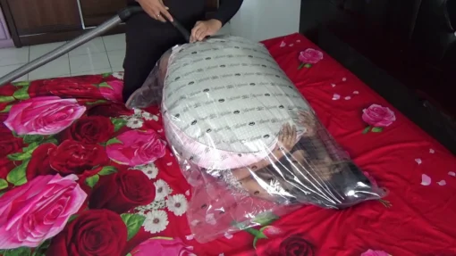 [RM131] Beautiful girl does not move and does not breathe in vacuum plastic - Image 2