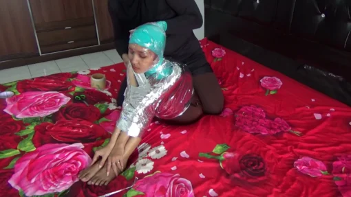 [RM132] A girl is wrapped tightly in a difficult Sitting position with chrome duct tape - Image 2