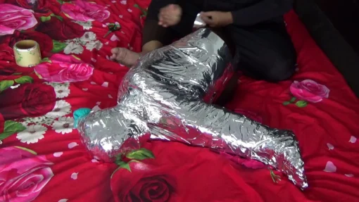 [RM132] A girl is wrapped tightly in a difficult Sitting position with chrome duct tape - Image 5