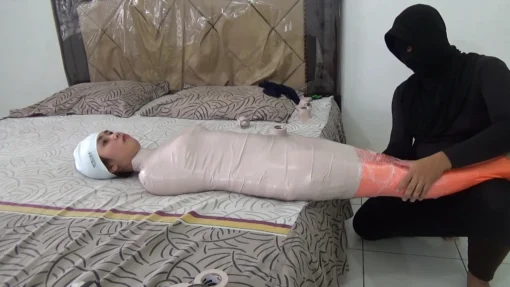 [RM137] Girl Wrapped In Mummy Then Put In Ballgag Because She Wouldn't Have Her Head Wrapped - Image 3