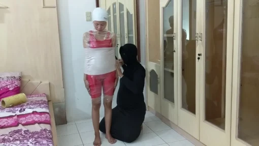 [RM141] This girl is wrapped in 2 layars duct tape and her legs are tickled - Image 2