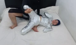 [RM161] This Girl Is Wrapped Tightly In Frogtied Position Like A Helpless Pet Wrapped In Duct Tape