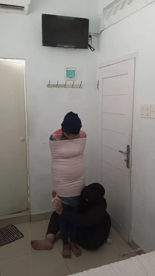 [RM164] A Girl Tries To Become A Mummy With Duct Tape For The First Time In Her Bedroom - Image 3