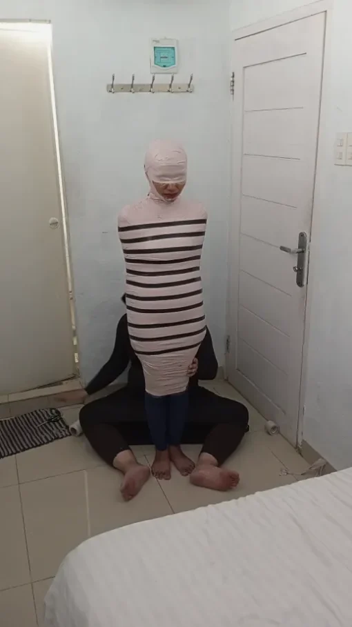 [RM164] A Girl Tries To Become A Mummy With Duct Tape For The First Time In Her Bedroom - Image 4