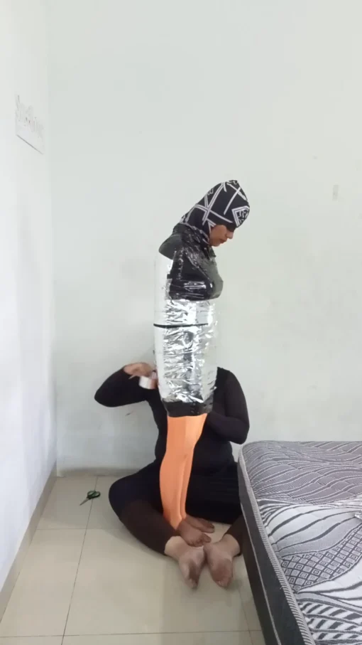 [RM169] Pakistani Girl Wrapped Tightly In Chrome Tape & Breath Restricted Until She Struggles & Crying To Submit - Image 2