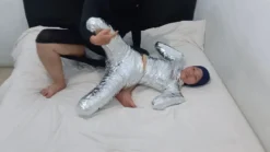 [RM161] This Girl Is Wrapped Tightly In Frogtied Position Like A Helpless Pet Wrapped In Duct Tape